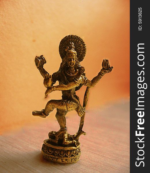 A small idol of the powerful Lord Shiva in his dance pose made of bronze metal, of hindu religion