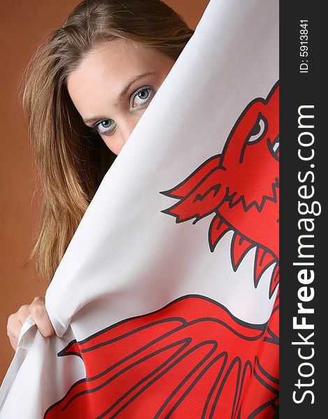 Beautiful young female model with a Welsh Flag. Beautiful young female model with a Welsh Flag