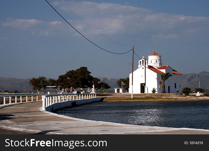 A white orthodox church on a Greek island at summer