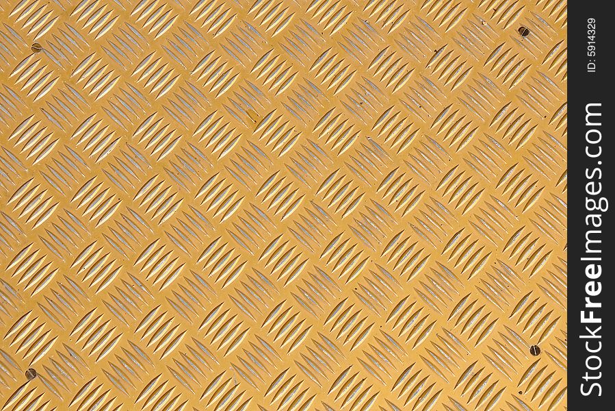 Yellow metallic surface with pattern for background