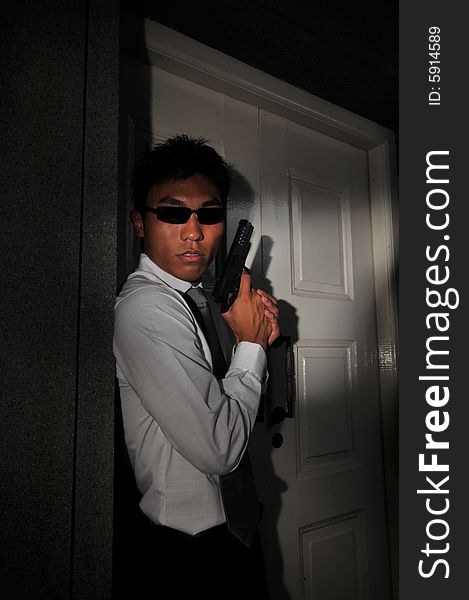 Picture of Agent or Killer. Low key photography suitable for themes of modern security, terrorism and police counter terrorist acts. Picture of Agent or Killer. Low key photography suitable for themes of modern security, terrorism and police counter terrorist acts.