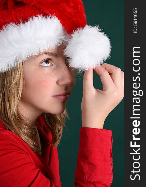 Teenager wearing a red shirt and a christmas hat