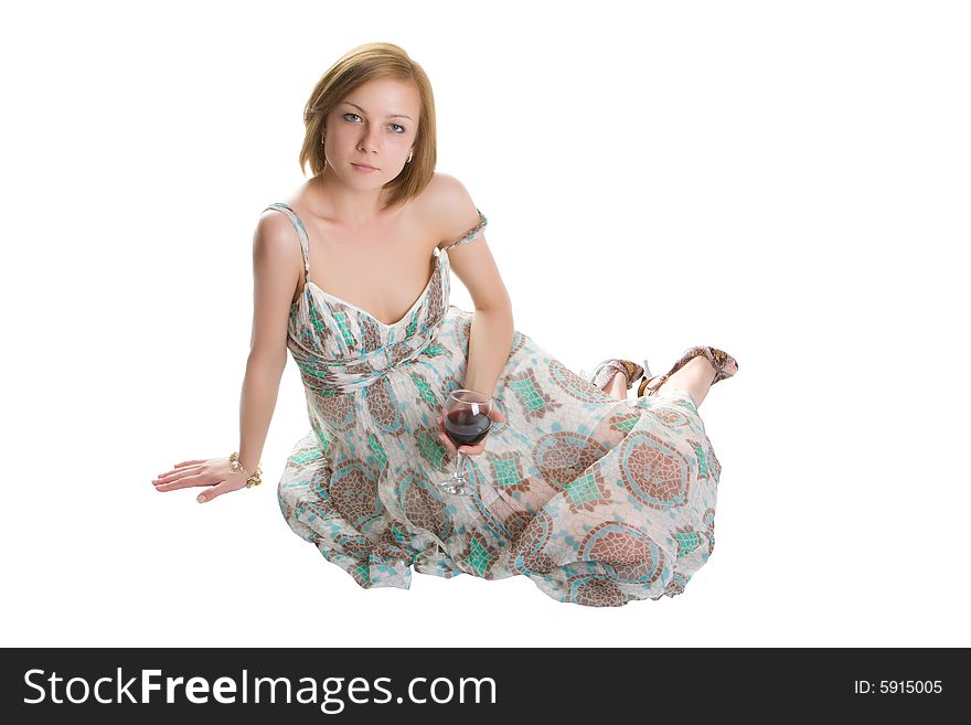 Woman isolated on a white background sitting with a glass of red wine in a hand. Woman isolated on a white background sitting with a glass of red wine in a hand