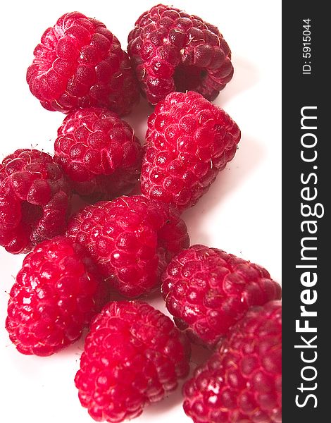 Closeup of raspberries on white background