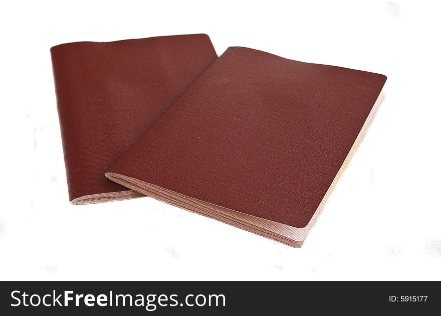 Two red passports isolated on white background