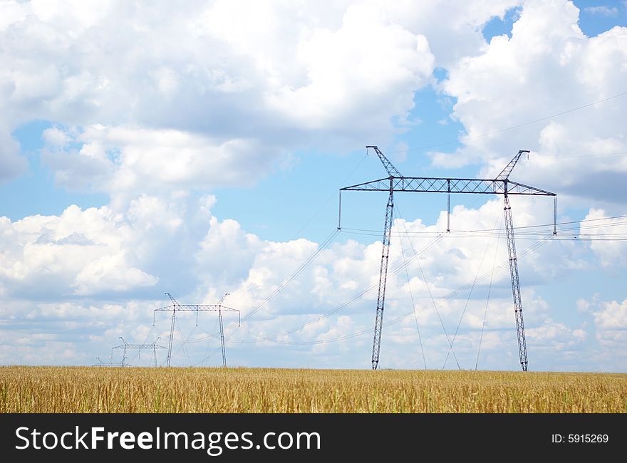 Electrical powerlines with blue sky and white clouds