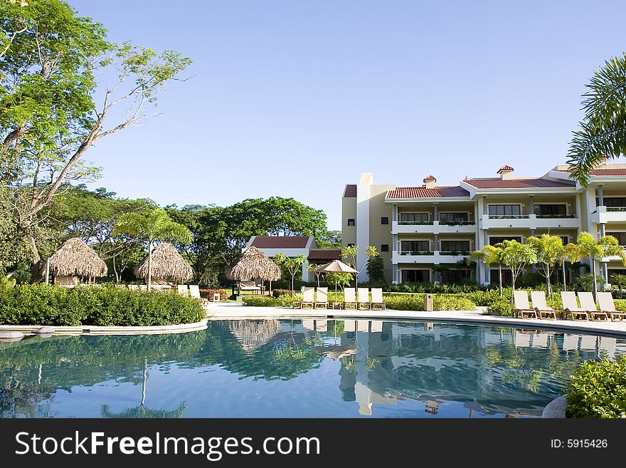 A tropical resort with a blue lagoon pool. A tropical resort with a blue lagoon pool