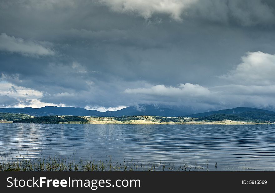 Landscape with lake and clouds