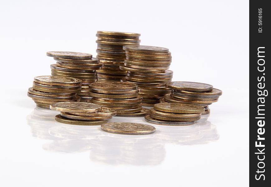 Stacks of coins isolated on white. Stacks of coins isolated on white