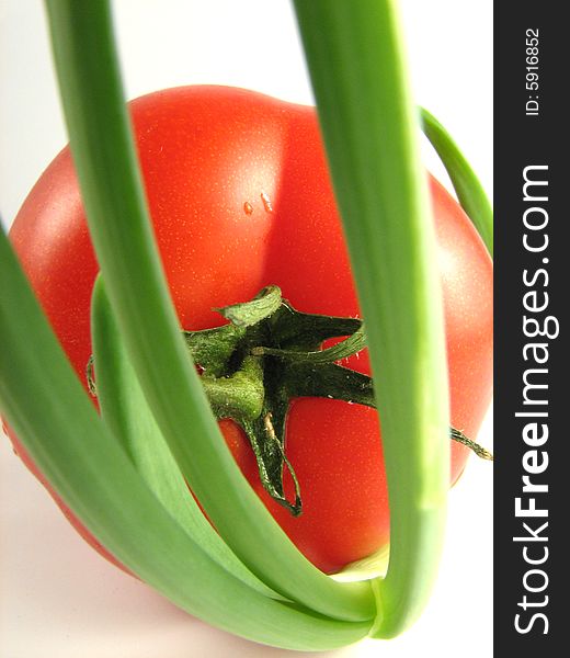 Tomato and spring onion - close up photo