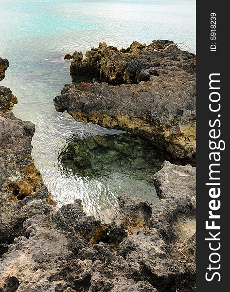 Detail of coastline with rocks on tropical beach. Detail of coastline with rocks on tropical beach