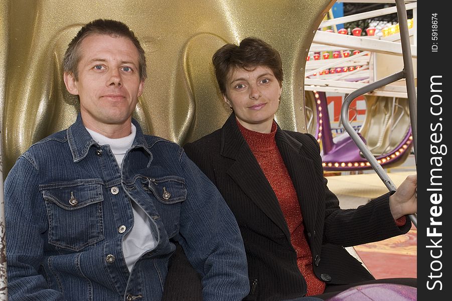 Spouses in an amusement park