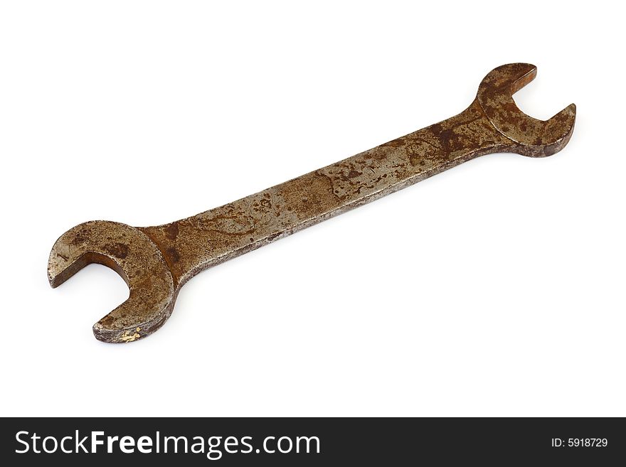 Old rusty spanner isolated on white background