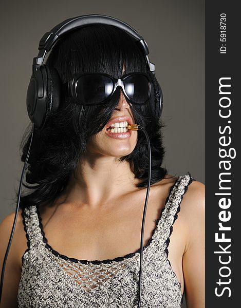 Portrait of young bizarre woman with headphones. Portrait of young bizarre woman with headphones