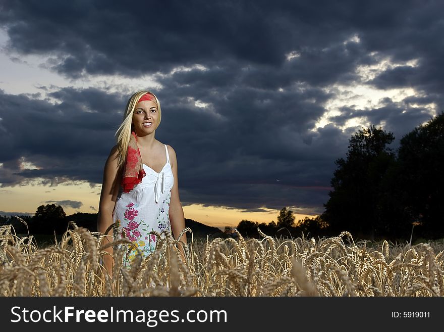 Girl standing in wheat field. Girl standing in wheat field.