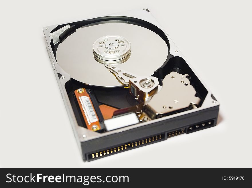An opened hard disc and isolated over white.