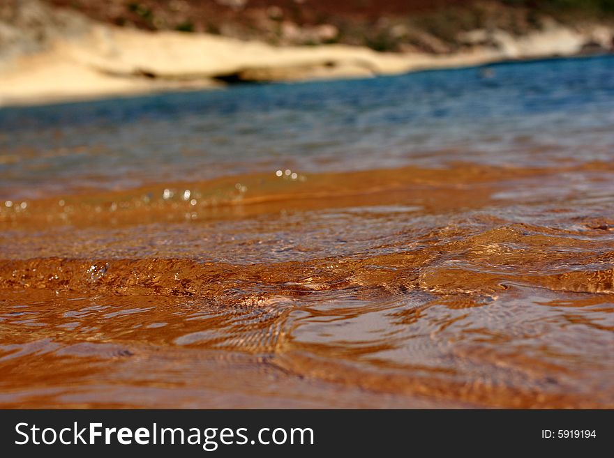 Transparent sea water on a sandy beach