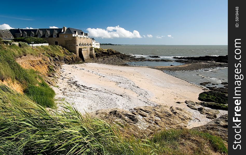 Landscape view of a castle overhanging the wild coast of Britain, France. Landscape view of a castle overhanging the wild coast of Britain, France