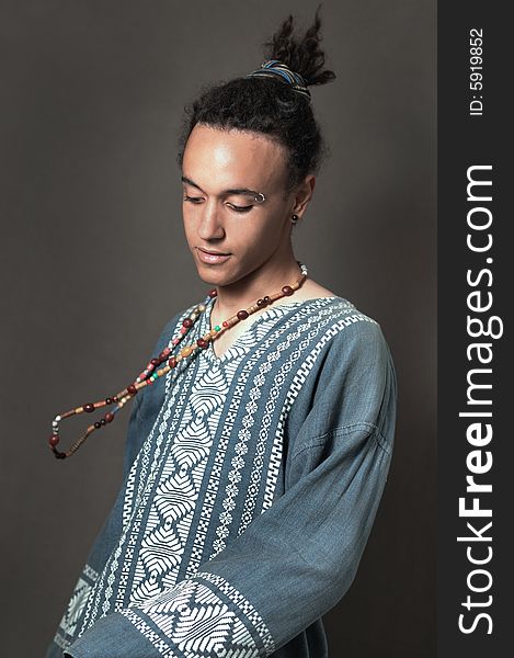 Portrait of young multiracial male in ethnic style. Portrait of young multiracial male in ethnic style