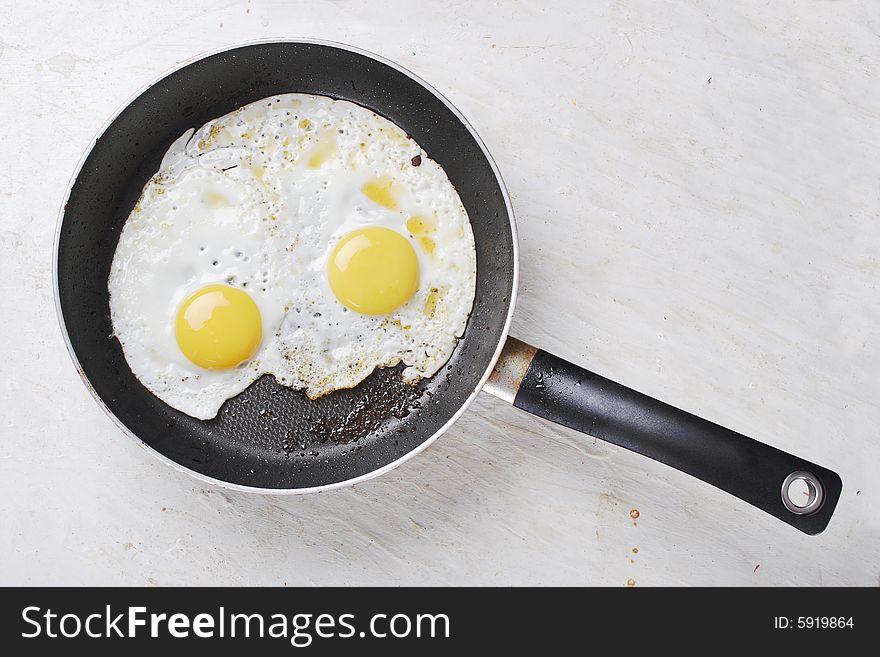 Hot fried eggs on the frying-pan. Hot fried eggs on the frying-pan.