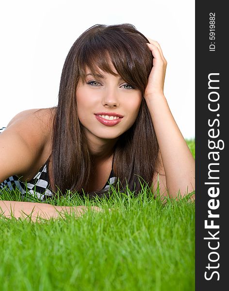Smiling woman relaxing in the grass. Smiling woman relaxing in the grass