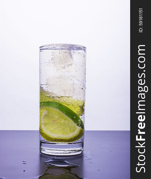 Soda with lemon and lime in the glass