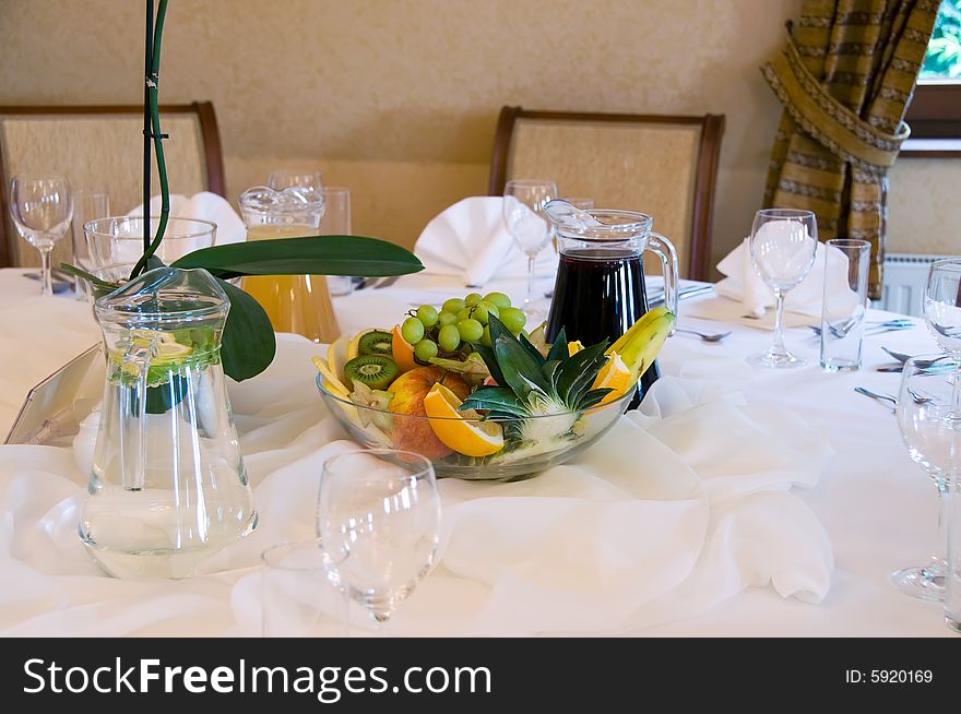 Fruits, juice and water on banquet table. Fruits, juice and water on banquet table