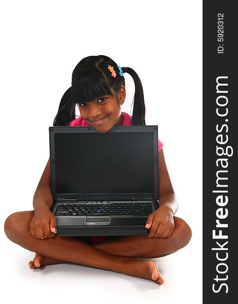 Beautiful 10 year old Indian child with laptop. Beautiful 10 year old Indian child with laptop.