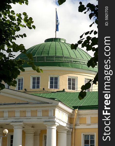 Building of establishment with a tower and a flag