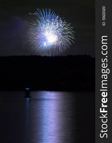 Firework And Reflection On Water