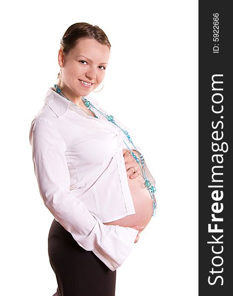 Beautiful pregnant woman against white background
