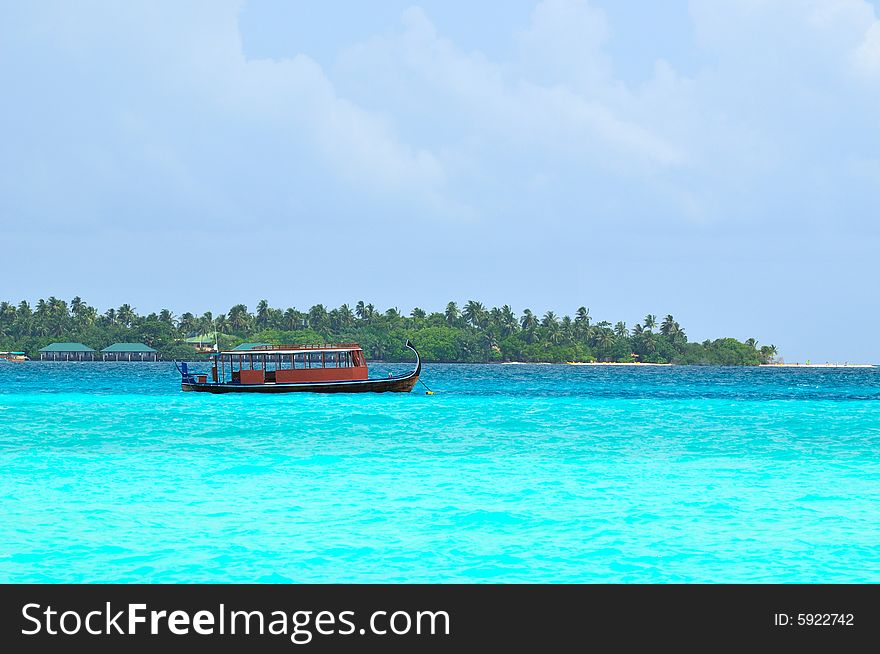 Island of Paradise. White sand beaches with coco-tree and crystal blue water. Maldives. Luxury holidays. Island of Paradise. White sand beaches with coco-tree and crystal blue water. Maldives. Luxury holidays.