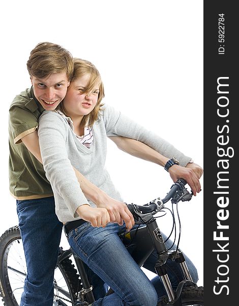 Young couple on a bicycle isolated on a white