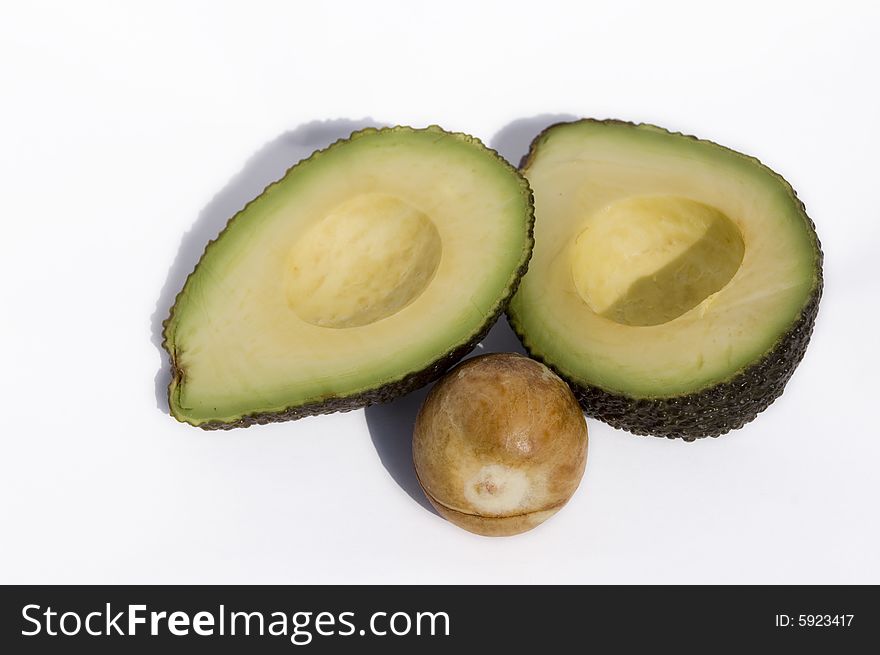 Two half of avocado with seed