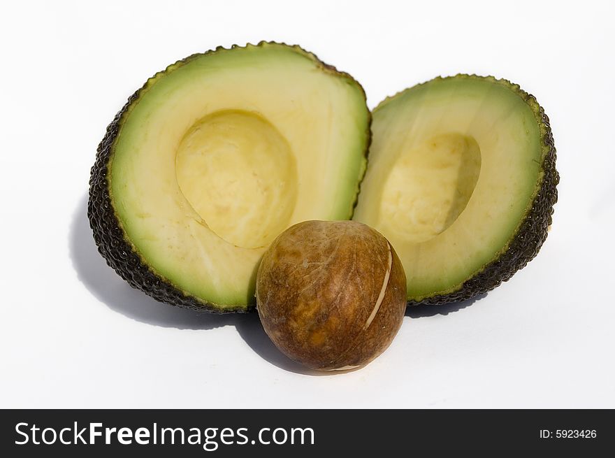 Two half of avocado with seed