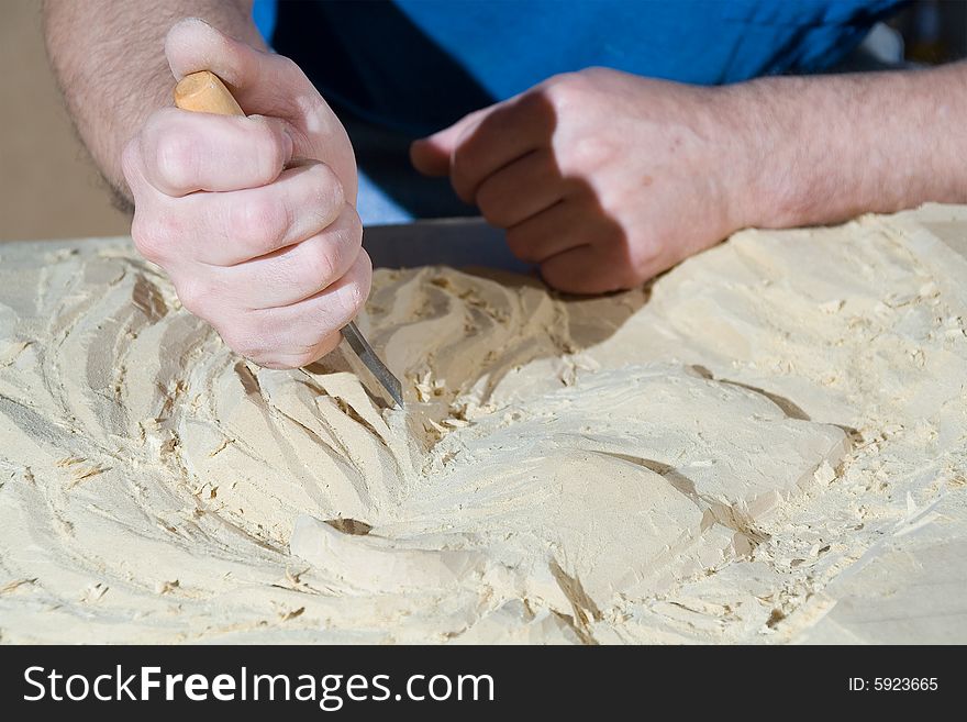 Hands of the carver. work place. Hands of the carver. work place