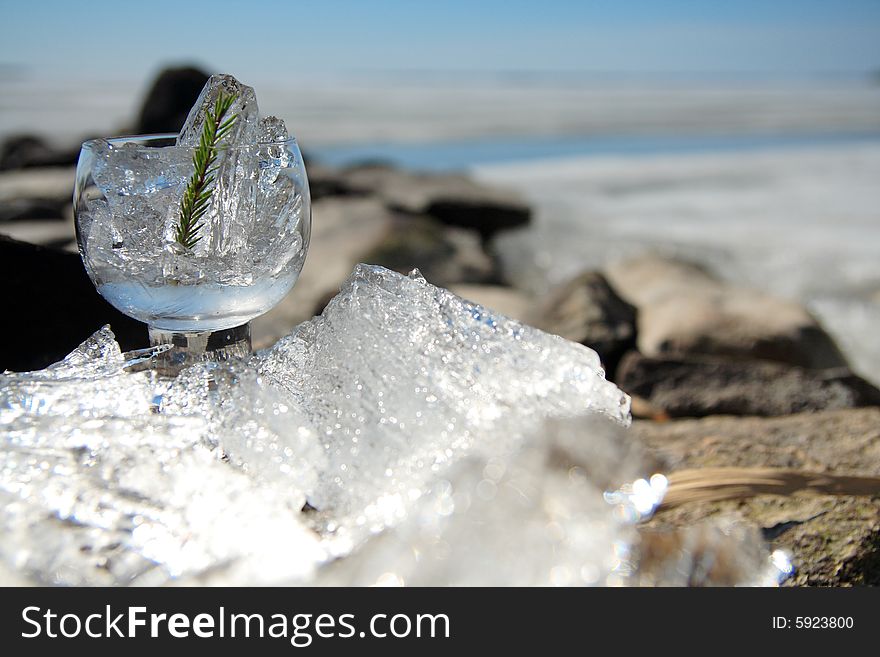 Glasses with ice on the edge of a frozen lake