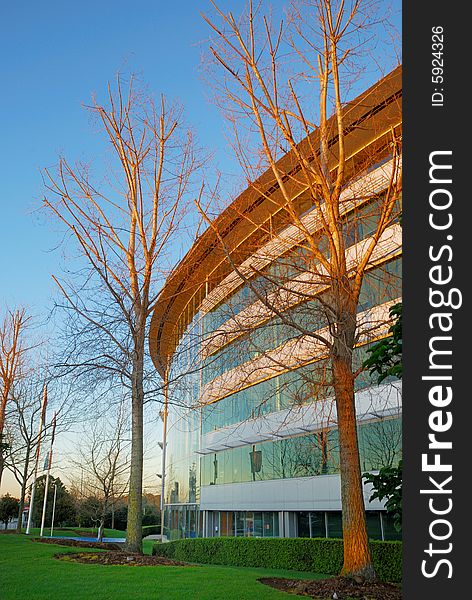 Modern office building in sunrise light