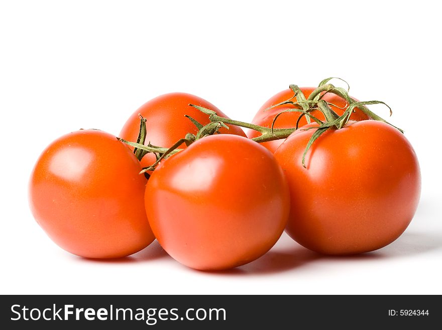 Fresh appetizing tomatoes on a white background. Fresh appetizing tomatoes on a white background