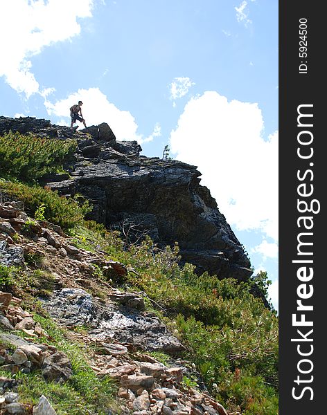 Mountain, sky and the man on the top