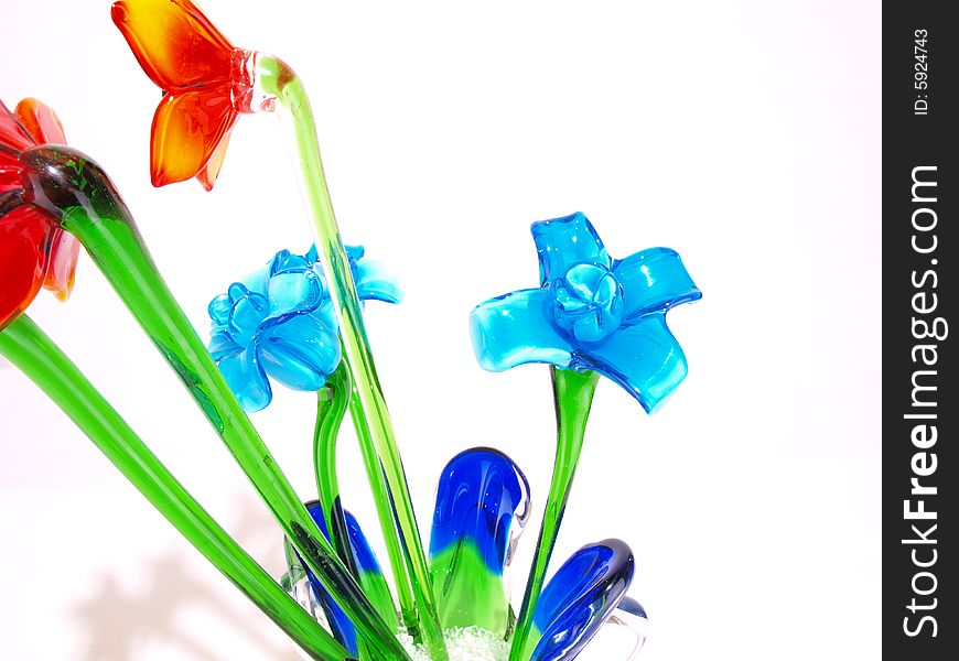 Shiny Blue crystal flowers with green stems among others