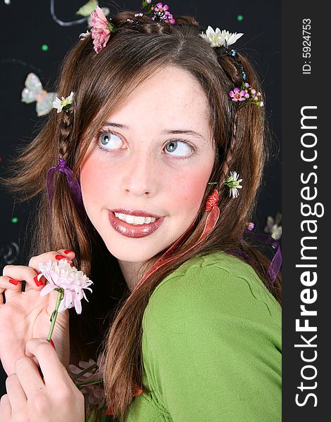 Teenage model with flowers and butterflies in her hair. Teenage model with flowers and butterflies in her hair