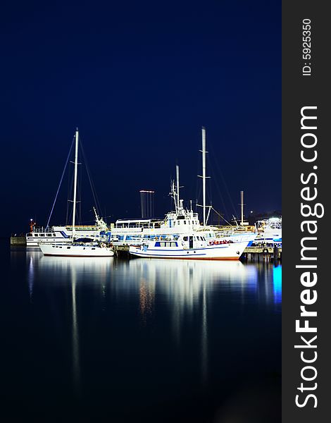 Yachts near the pier. Shot at night. Yachts near the pier. Shot at night.