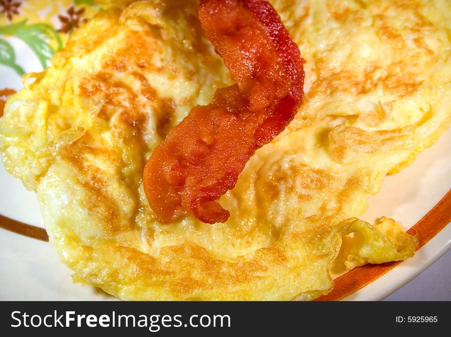 Eggs and bacon on dish ready to eat or serve. Eggs and bacon on dish ready to eat or serve