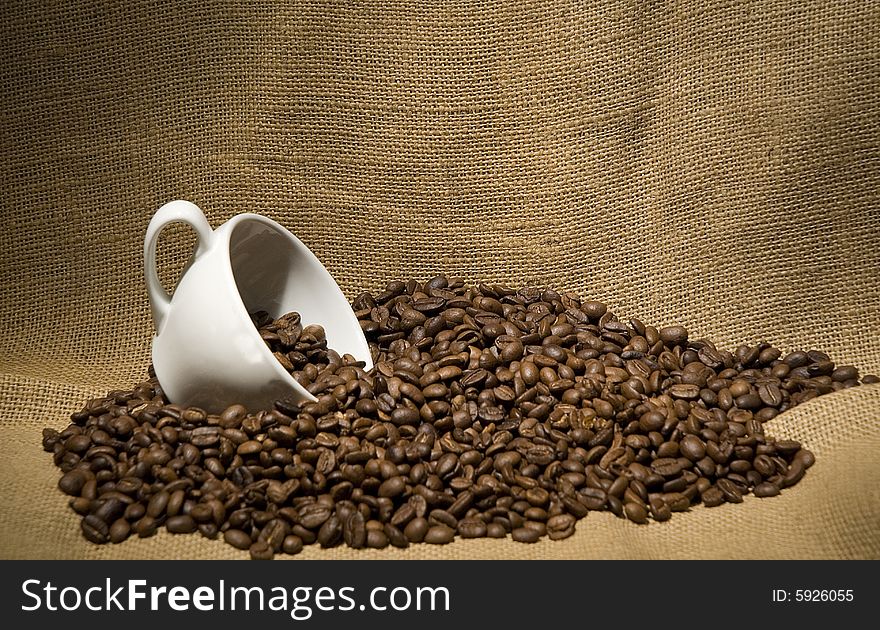 Coffee beans with a cup of coffee. Coffee beans with a cup of coffee