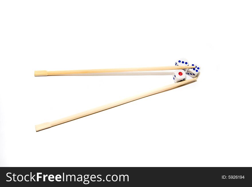 Chopsticks and dices on white background