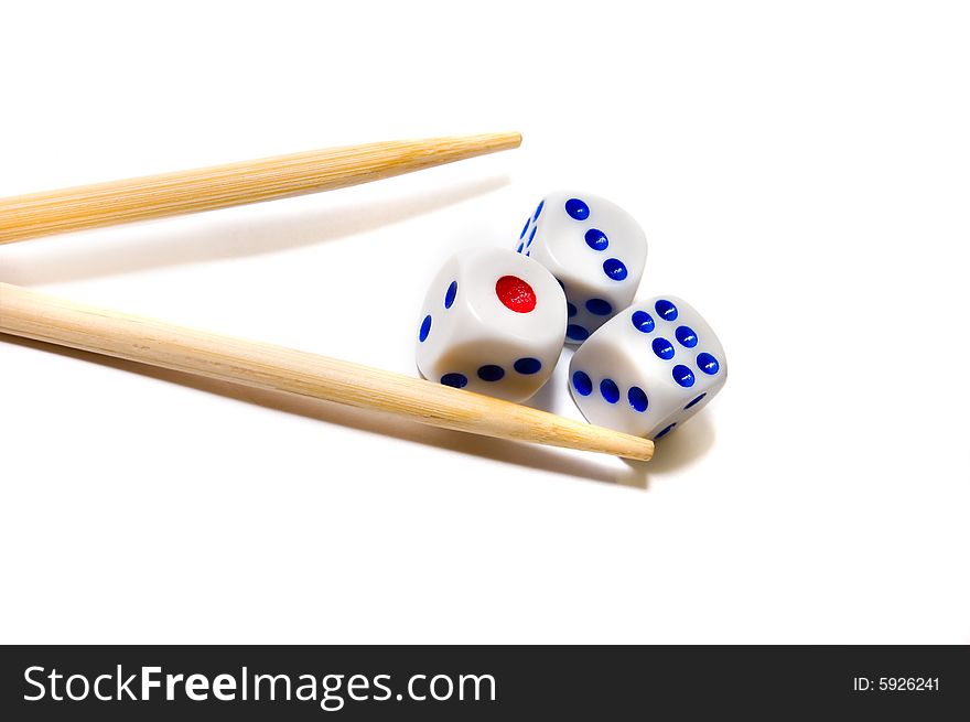Chopsticks and dices on white background