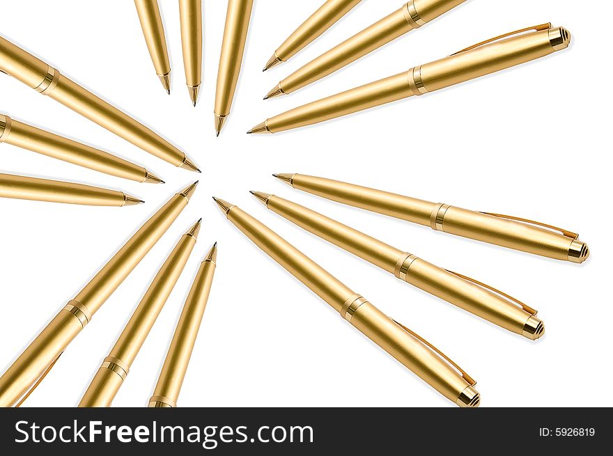 Gold pens on white background