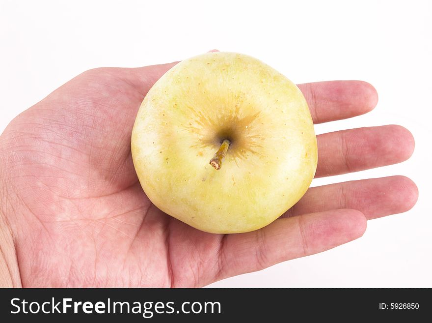 The apple on the hand.