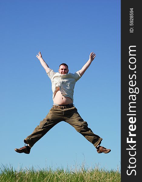 Happy man jumping on sky background. Happy man jumping on sky background